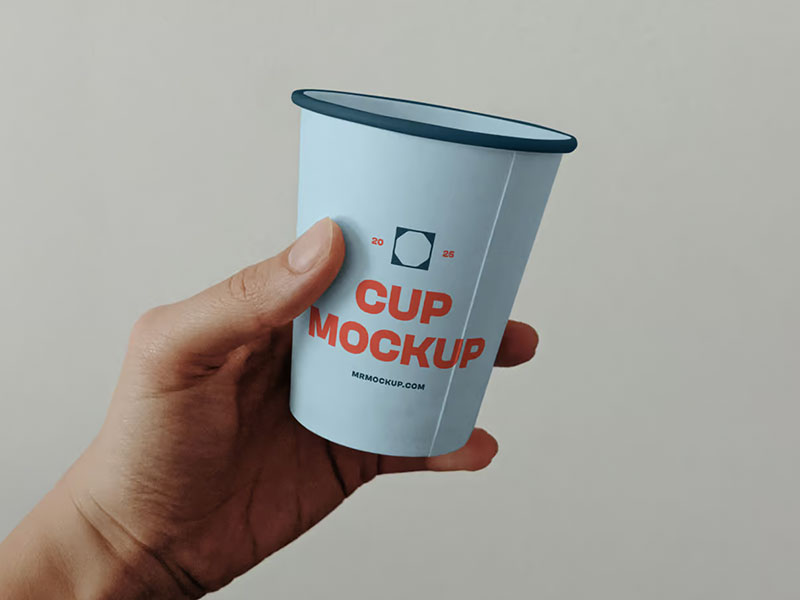 Free Paper Cup in Hand Mockup