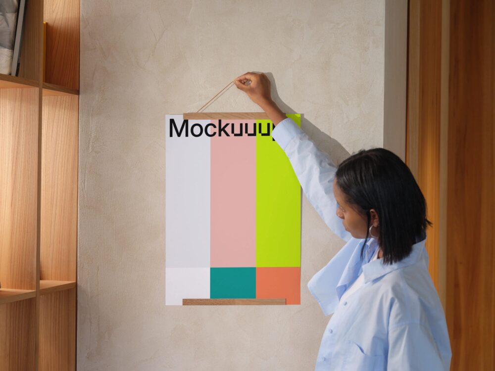 A3 poster mockup held against a textured wall