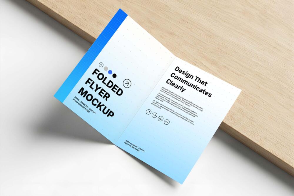 Folded Flyer Mockup on Wooden Surface