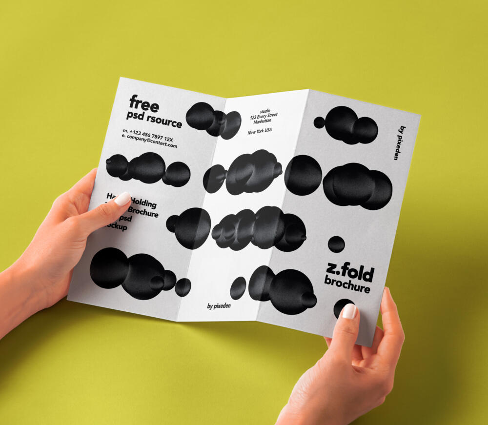 Hand Holding Folded Psd Brochure Mockup