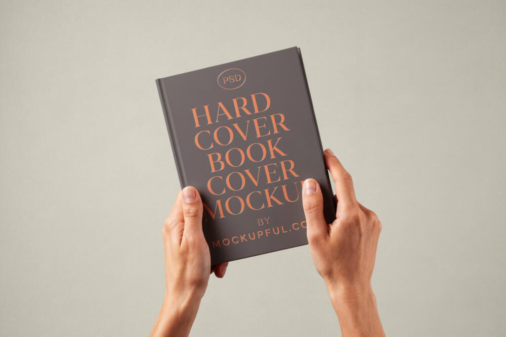 Hand Holding Hardcover Book Mockup