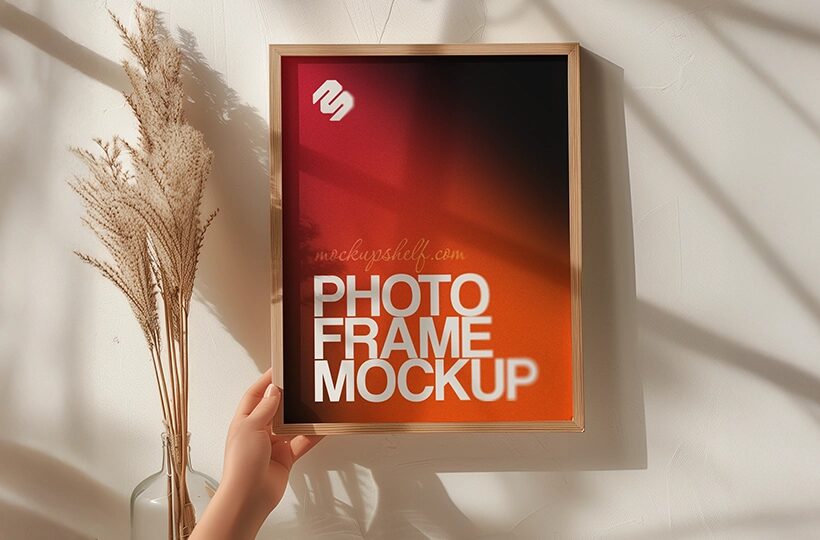 Handheld Photo Frame Mockup PSD, Sunlit Wall Scene
