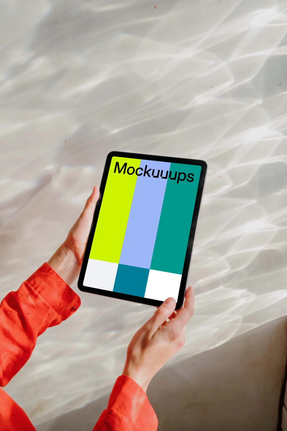 iPad Air mockup held by user against a bright silver background