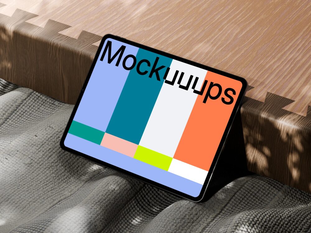 iPad Pro mockup on textured fabric and wooden surface