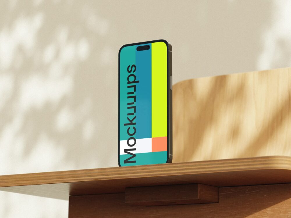 iPhone mockup on a wooden desk in sunlight