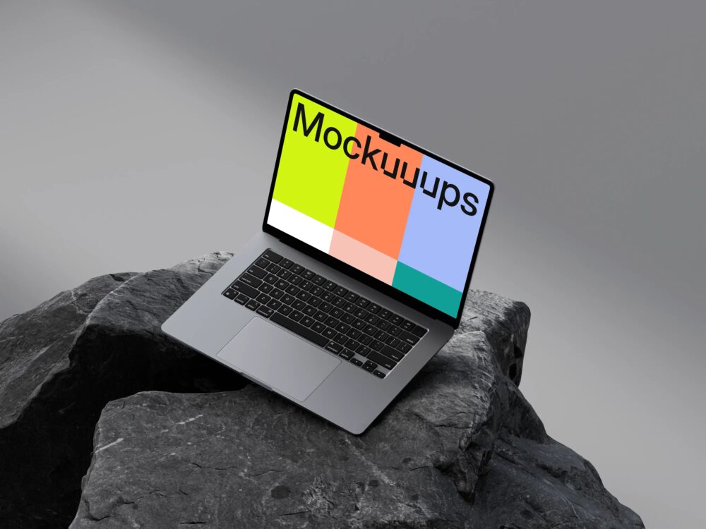 MacBook Air 15" mockup on dark textured rocks