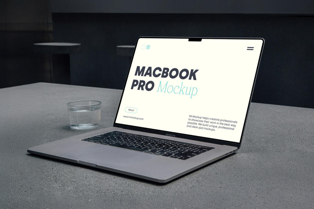MacBook Pro Laying On Concrete Mockup