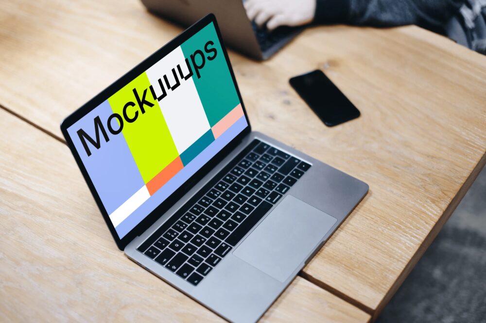 Macbook Pro Space Gray mockup on the wooden table
