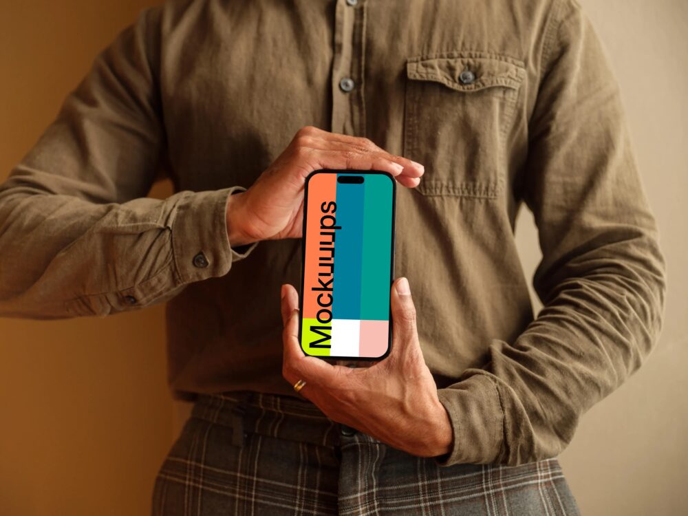 mockup of man in khaki shirt holding the iPhone