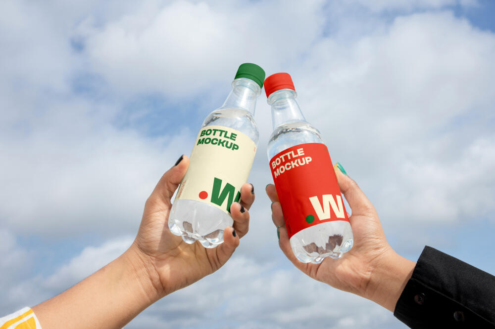 Two Bottle in Hand Mockups